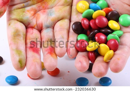 Colorful Chocolate Candies Leaving Its Pigment on Hand