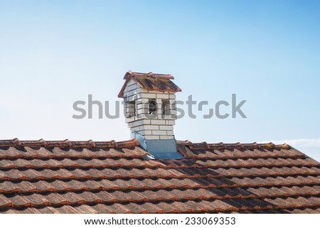 Close up chimney like a littl house on the roof