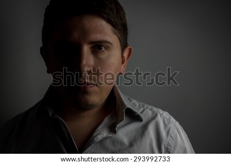 dark side of a business man. Portrait shot