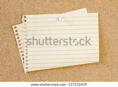 sheet of blank paper isolated on cork background