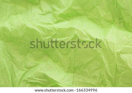 crumpled green crepe paper texture as background