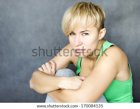 portrait of young disappointed woman in bad mood