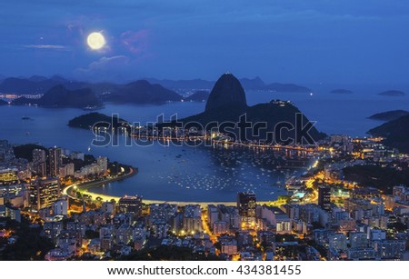 Night view with moon of mountain Sugar Loaf and Botafogo in Rio de Janeiro