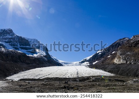 The Columbia Icefield is the largest ice field in the Rocky Mountains of North America. Located in the Canadian Rockies astride the Continental Divide along the border of British Columbia and Alberta