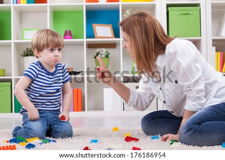 Angry mother scolding a disobedient child Angry mother scolding a disobedient child