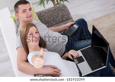 Young attractive couple success internet shopping