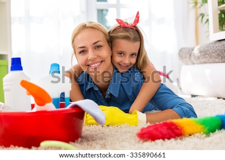 Lovely happy family having time together and cleaning home