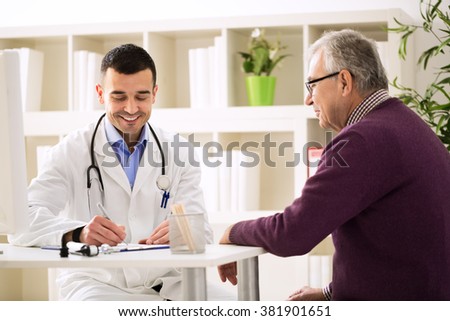 Specialist doctor and patient smiling and talking in office