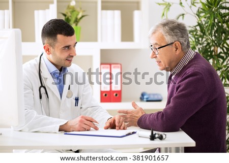 Doctor listening to patient explaining his painful in his office