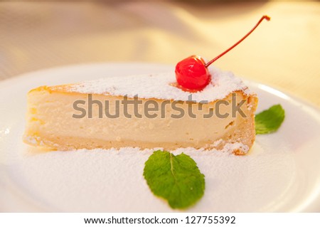 Fresh, appetizing cheese cake with cherry