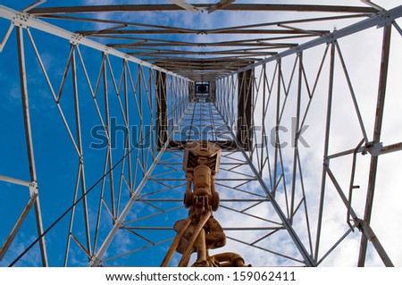 Interior upward view of an old oil rig - stock photo