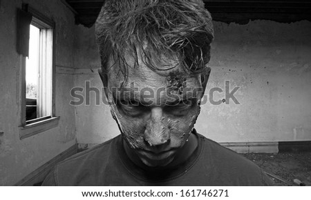 Zombie close up in a deserted run down house in black and white