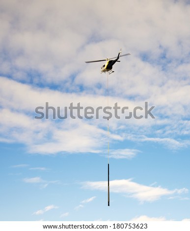 EDMONTON, AB, CANADA-March 9, 2014: A transport helicopter moves construction material in downtown Edmonton.