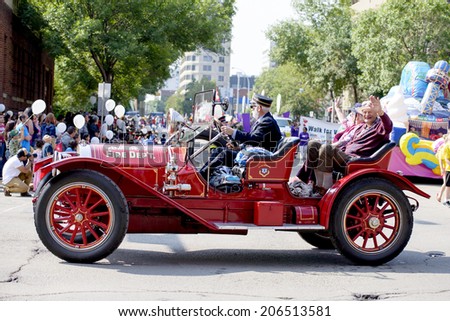 EDMONTON, AB, CANADA-July 18, 2014:  Old Edmonton Fire Chief car as seen in the K-Days Parade on July 18th, 2014.