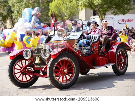EDMONTON, AB, CANADA-July 18, 2014:  Old Edmonton Fire Chief car as seen in the K-Days Parade on July 18th, 2014.