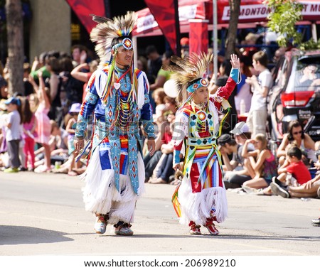 EDMONTON, AB, CANADA-July 18, 2014: People in traditional Native American clothing as seen in the K-Days Parade on July 18th, 2014.