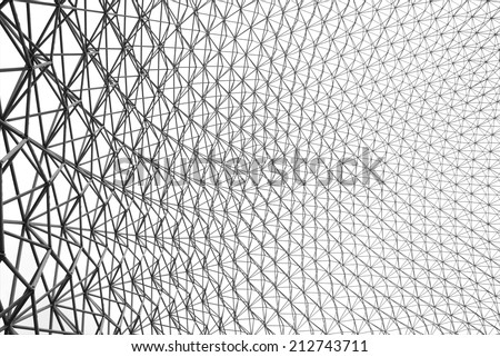 Upward image of the inside of a geodesic dome in black and white