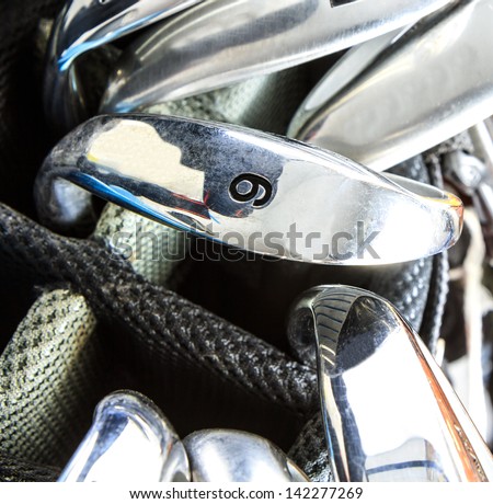 golf club set in carrier bag