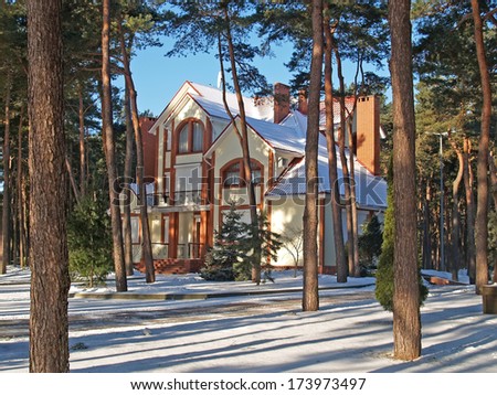Winter. Cottage in the pine wood