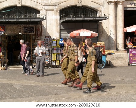 JERUSALEM, ISRAEL - OCTOBER 09, 2012: Soldiers of the Israeli army go down the street Via Doloroza