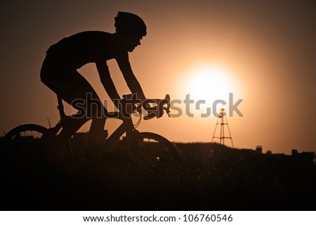 Silhouette of bicyclist on cycle track