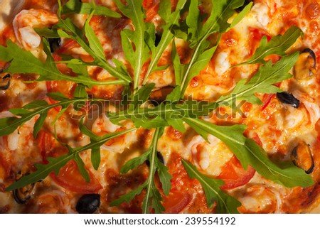 Pizza with arugula salad