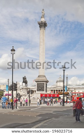 LONDON, ENGLAND - AUGUST 23, 2012: Busy crossroad near Trafalgar Square with Nelson\'s Column
