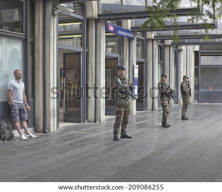 LILLE, FRANCE - JULY 15, 2014: LILLE, FRANCE - JULY 15, 2014 - French Military Police soldiers patrol railway station Lille Flandres