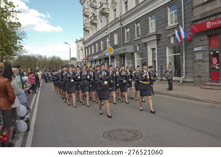 PSKOV, RUSSIA MAY 9, 2015: Girls - members of The Border Guard Service of Russia  are singing at the Victory Parade while marching