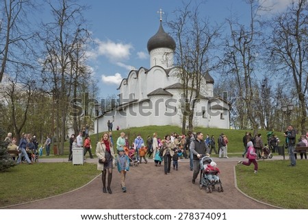 PSKOV, RUSSIA ?? MAY 9, 2015: People are having fun in the city park near old church