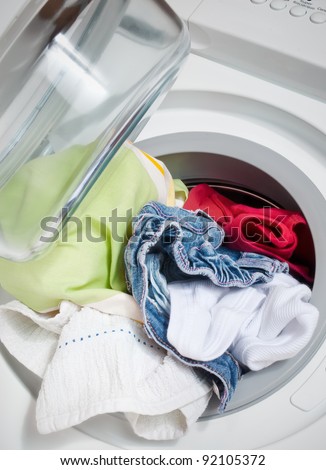 washing machine with colorful clothes inside