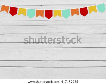 Brazilian june party, festa junina mockup. Birthday or baby shower mockup scene. String of paper flags. Party decoration. White wooden background, empty space. Top view.