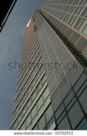 looking up at tall corporate office building
