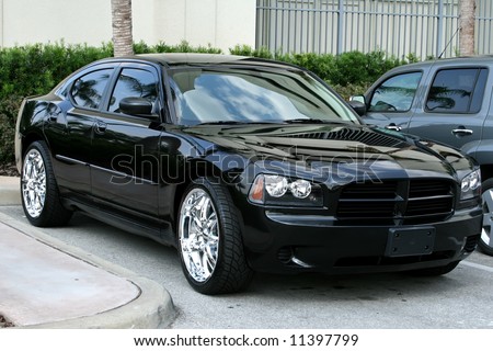 stock photo side of black reflecting american muscle car