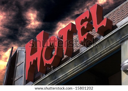 spooky red hotel sign with eerie sky background