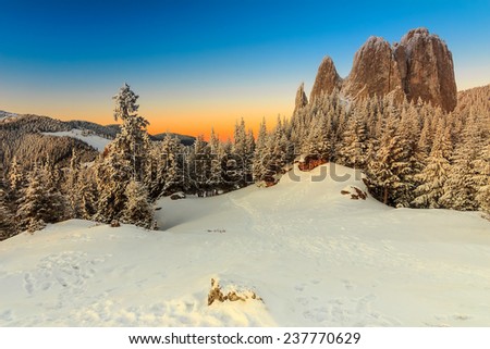 Majestic sunrise and winter landscape,Lonely-Rock,Carpathians,Transylvania,Romania,Europe