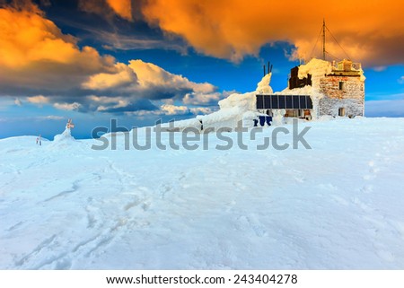 Mountain shelter with solar panel and majestic sunrise,Bucegi mountains,Carpathians,Transylvania,Romania,Europe