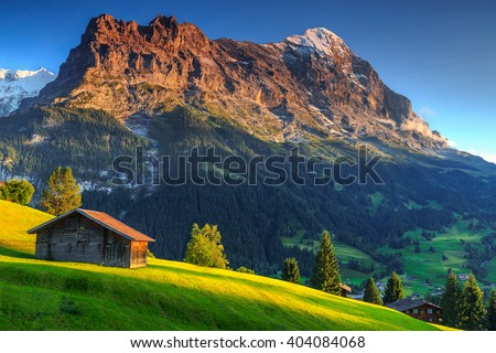 Spectacular Swiss alpine landscape with green fields and famous Eiger peak,Bernese Oberland,Switzerland,Europe