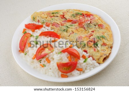 Tomato omelet with cooked white rice and vegetables.