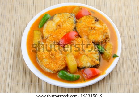 Asian style Fish curry with tomato and coconut milk mango.
