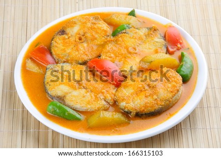 Baracuda Fish curry with tomato, coconut milk and mango Asian cuisine..