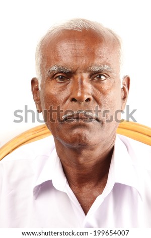 Senior Indian old man serious expression.