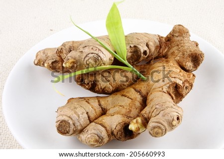 Organic fresh  ginger with ginger leaves.