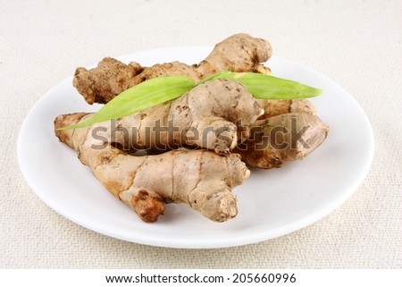 Organic  ginger root with ginger leaves.