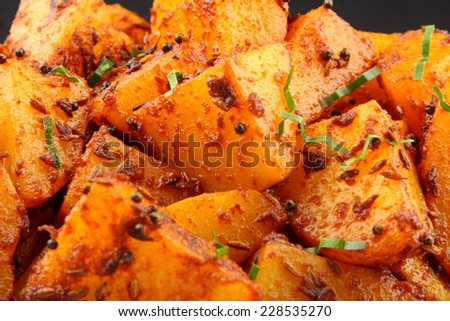 Fried potatoes with spices Asian cuisine .shallow depth of field photograph. shallow depth of field photograph.