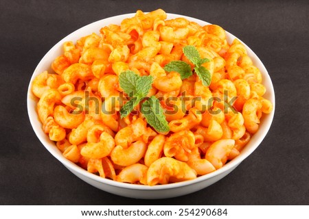 Bowl of  Pasta with tomato  and herbs .