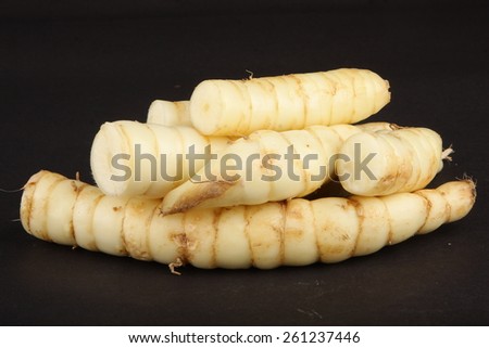 Organic arrowroot in black background.Shallow depth of field photograph.