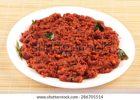 Chutney of red sweet peppers with spices.Shallow depth of field photograph.
