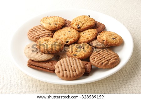 Oven fresh cookies and biscuits served in plate..