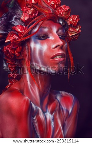 Portrait of painted woman in original head wear